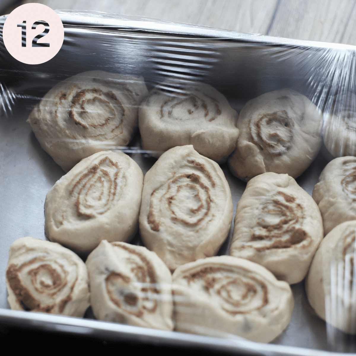 Allowing the cinnamon rolls to rise once more.
