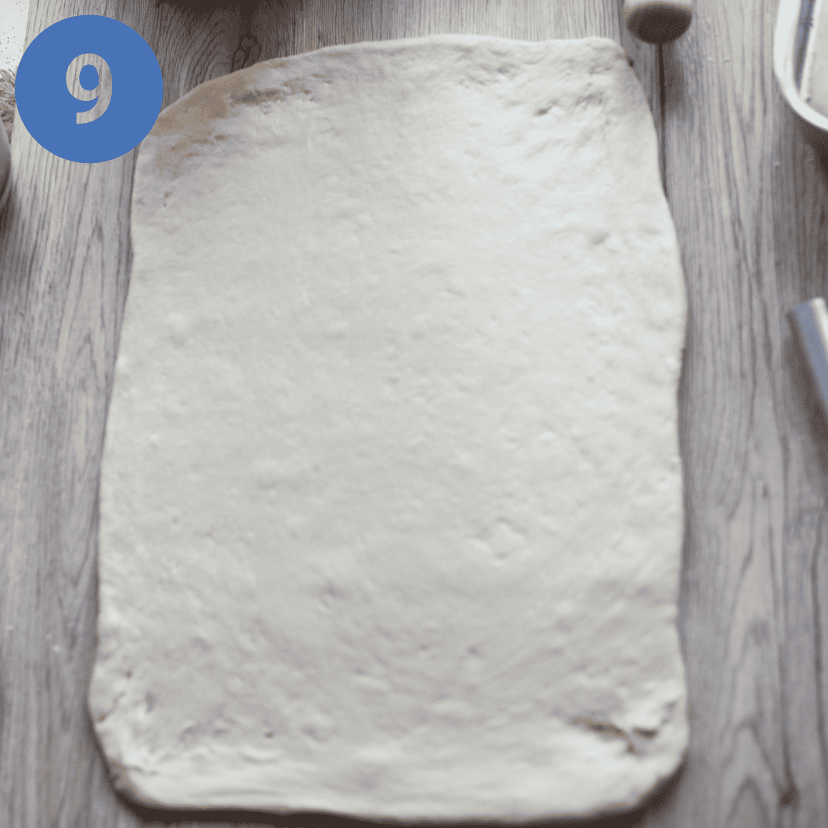 The rolled out dough for cinnamon rolls.