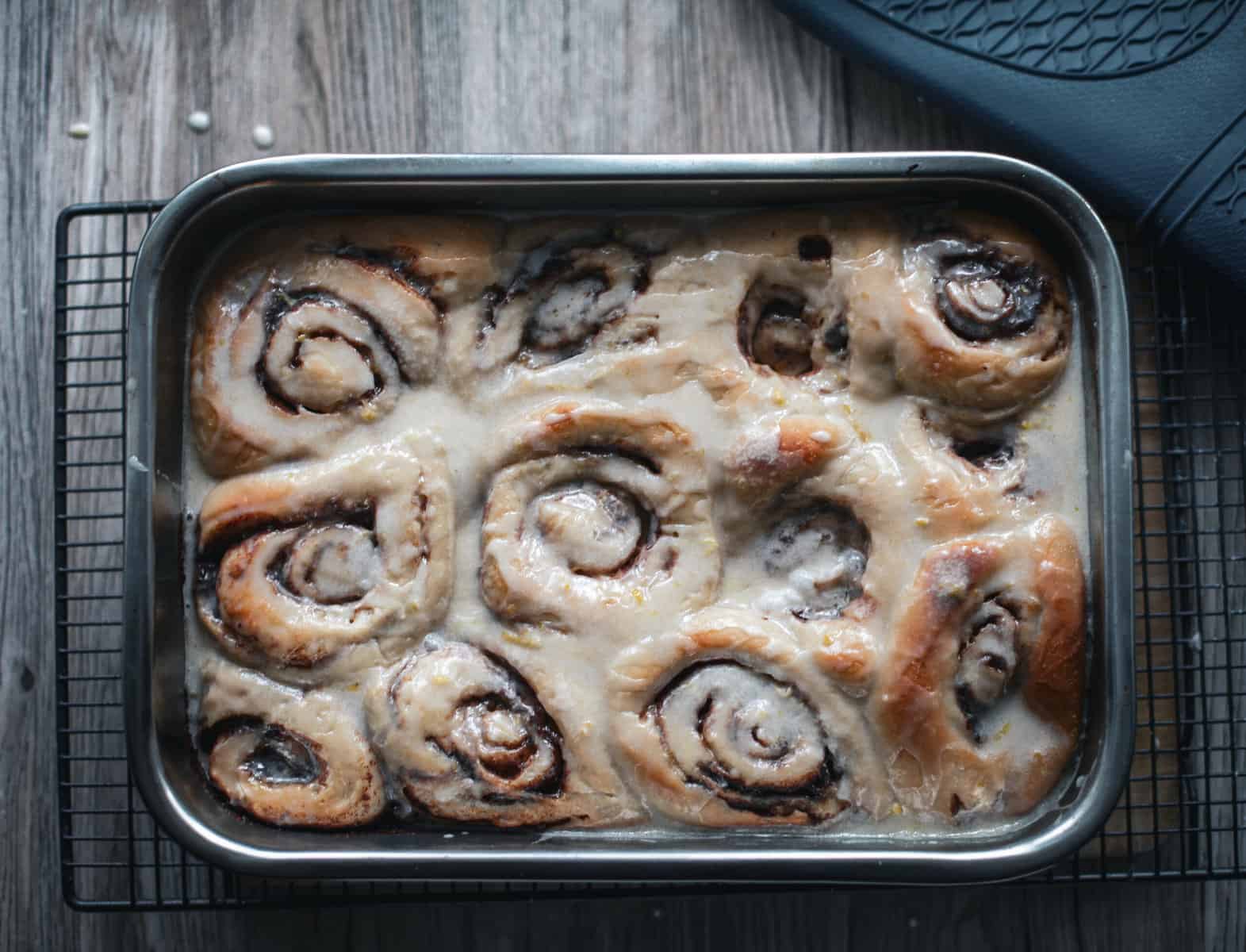 A tray of iced cinnamon rolls.